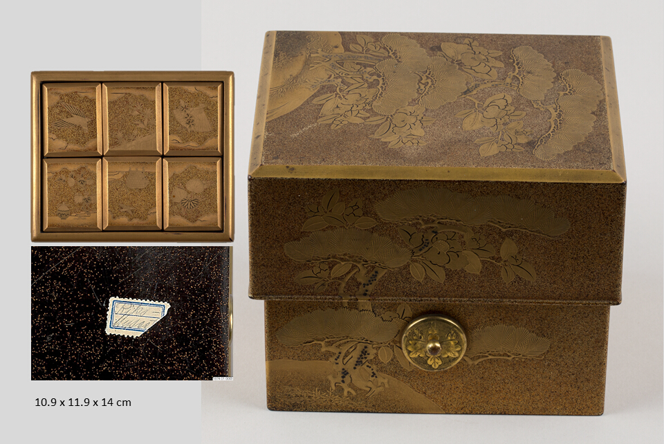 Square box with deeply overlapping lid with beveled edges. Inside fitted with a set of six nested, lidded containers. Outside makie decorations depicting kiri-mon leaves and flowers of Paulownia imperisalis on a pear-skin (nashiji) ground. Circular ornaments with the crest of Mikadon on two sides, to hold the now missing cord.