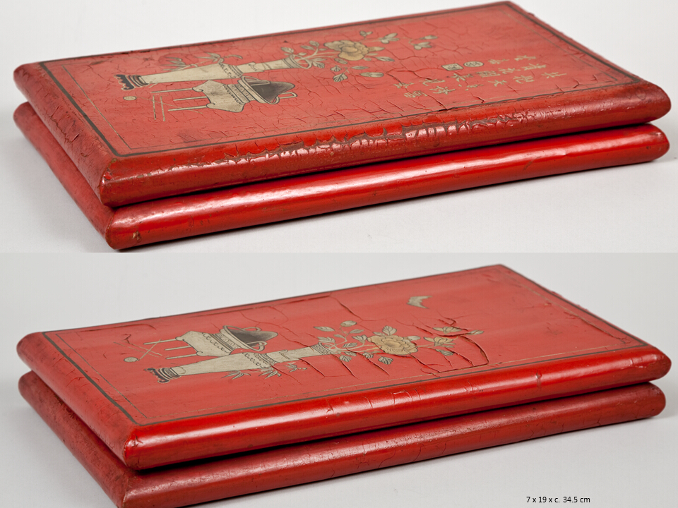  Flat, lidded, rectangular cases, outside monochrome red urushi with gold makie depicting a mirrored motif with flowers in a vase and a coal burner framed with gold and silver lines. One case also with Japanese kanji scripts, the other with a flying bird. Inside stamped on the monochrome green urushi surface.